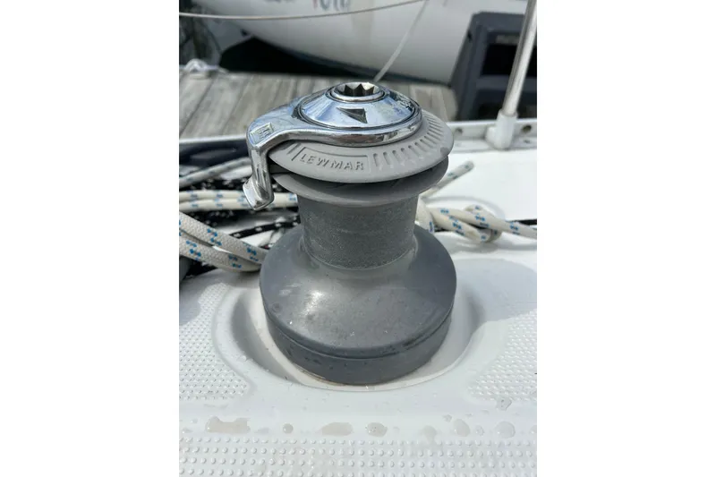 Slide: The Image of Winch on 1992 Beneteau First 35s5 sailboat, featuring Lewmar branding and coiled ropes. - 36