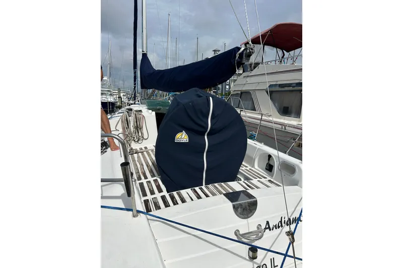 Slide: The Image of 1992 Beneteau First 35s5 sailboat deck with Doyle sail cover in marina. - 6