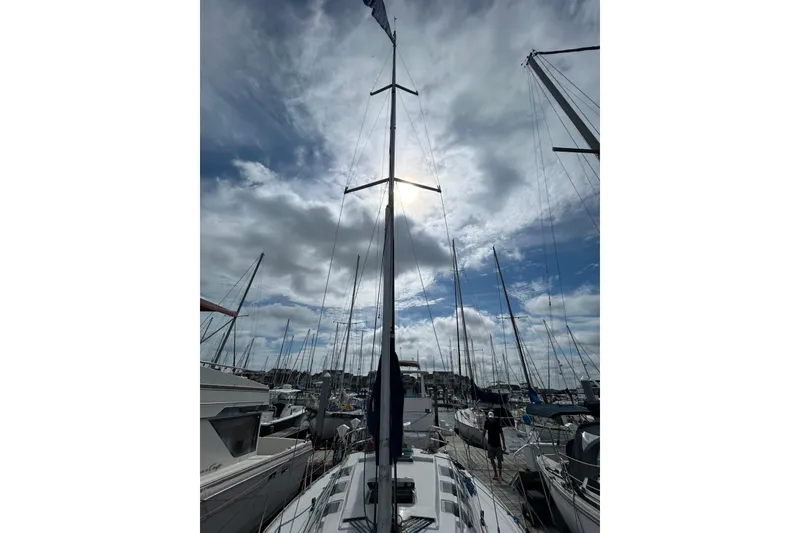 Slide: The Image of Sailboat Beneteau First 35s5, 1992 model, docked under cloudy sky. - 7