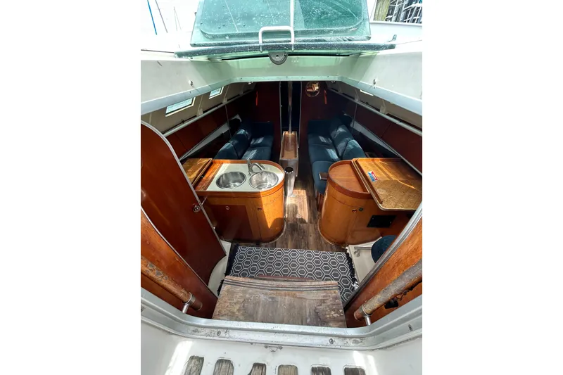 Slide: The Image of Interior of 1992 Beneteau First 35s5 sailboat with wood finishes and seating area. - 8