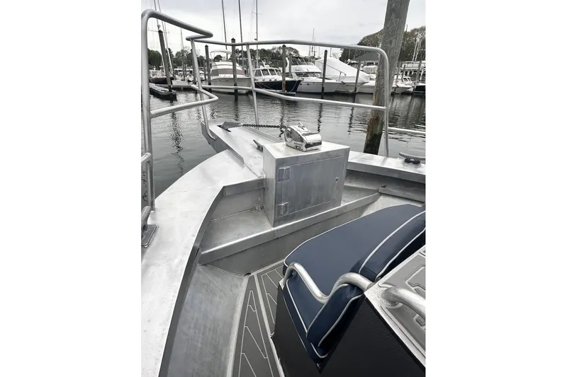 Slide: The Image of Aluminum deck of a 2009 Hunt 35 boat docked at a marina. - 16
