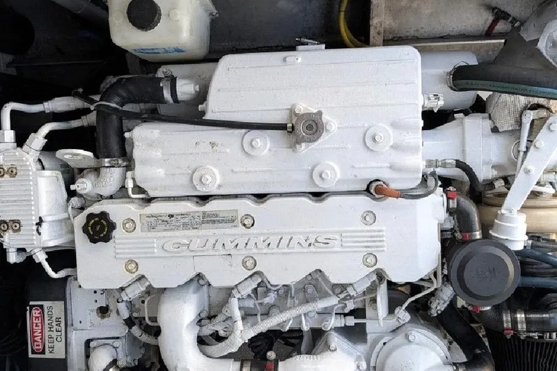 Slide: The Image of Engine of a 2009 Hunt 35 boat, featuring a Cummins diesel engine. - 5
