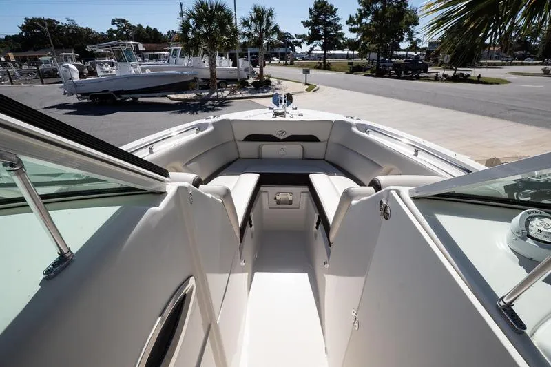 Slide: The Image of 2023 Sailfish 245 DC boat interior with seating and open deck view. - 19