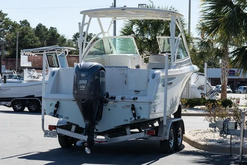 Slide: The Image of 2023 Sailfish 245 DC boat on trailer with Yamaha 300 V6 engine. - 6