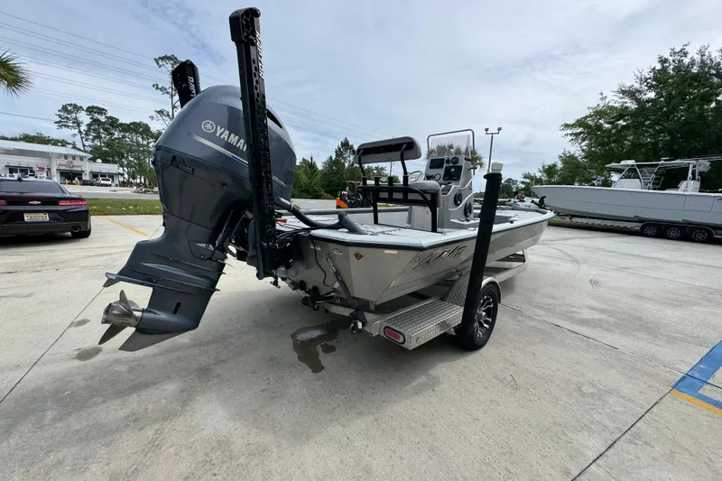 Slide: The Image of 2021 Avid 21 FS boat with Yamaha outboard motor on trailer in parking lot. - 11