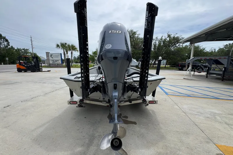 Slide: The Image of Avid 21 FS 2021 boat with 150 HP engine, parked outdoors. - 13