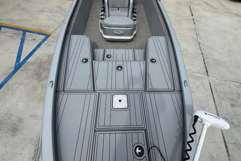 Slide: The Image of Avid 21 FS boat deck, 2021 model, featuring sleek gray design and Minn Kota trolling motor. - 20