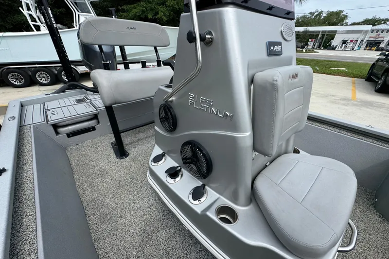 Slide: The Image of Interior of 2021 Avid 21 FS boat with seating and control panel. - 24
