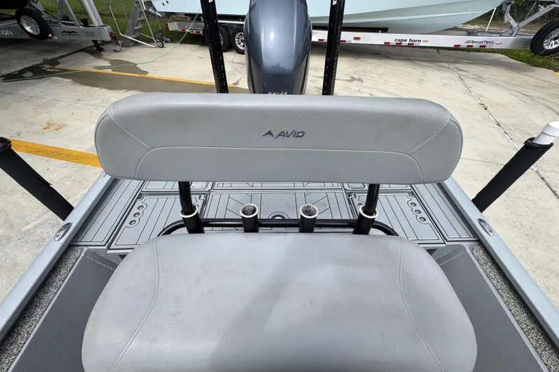 Slide: The Image of Avid 21 FS 2021 boat seat with rod holders on deck. - 26