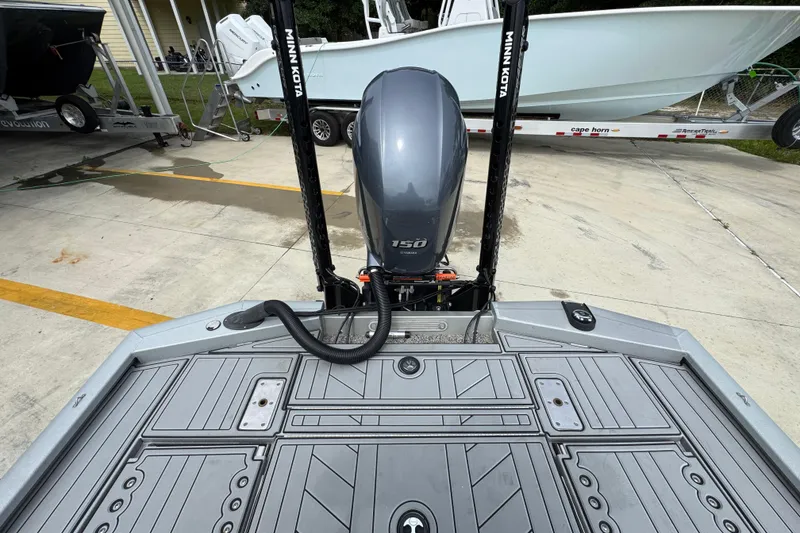 Slide: The Image of Avid 21 FS boat, 2021 model, featuring a 150 horsepower engine and Minn Kota accessories. - 31