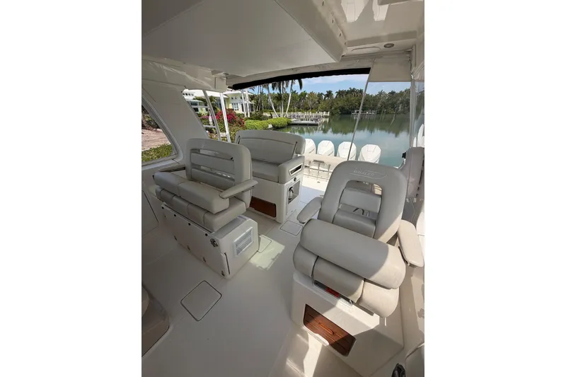 Slide: The Image of Interior of 2022 Boston Whaler 380 Realm boat with luxurious seating and scenic water view. - 4