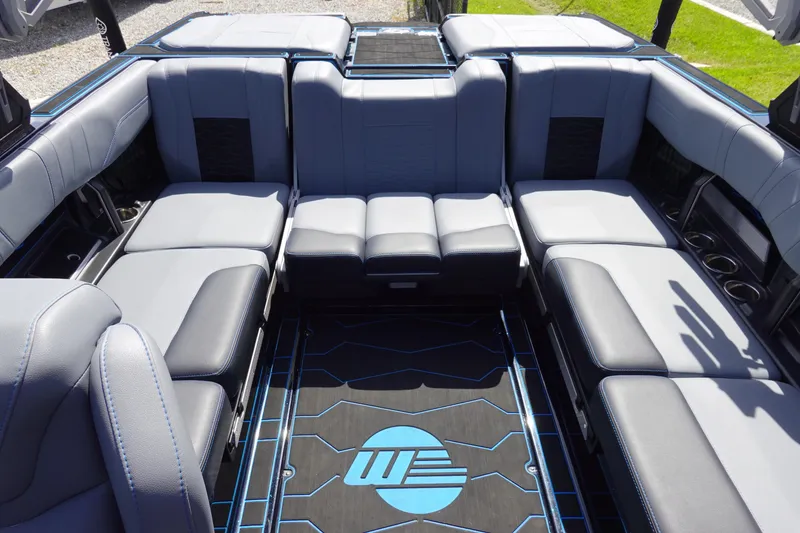 Slide: The Image of 2024 Malibu Wakesetter 23 MXZ interior with luxurious seating and modern design. - 10