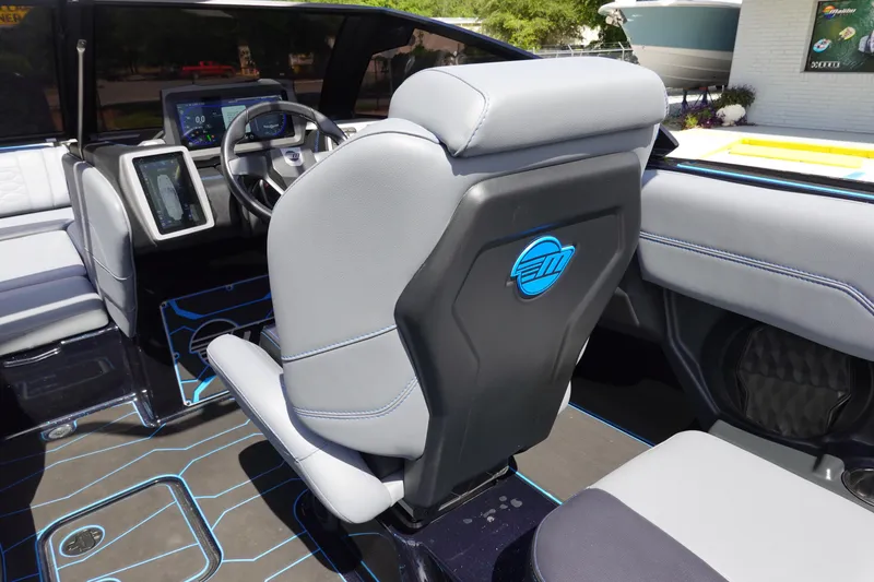 Slide: The Image of 2024 Malibu Wakesetter 23 MXZ interior with modern dashboard and seating. - 15
