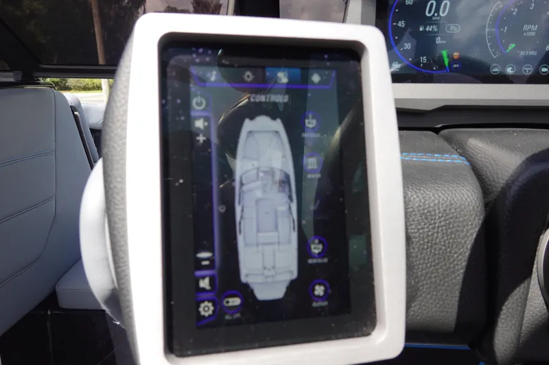 Slide: The Image of 2024 Malibu Wakesetter 23 MXZ dashboard with touchscreen controls and digital display. - 18