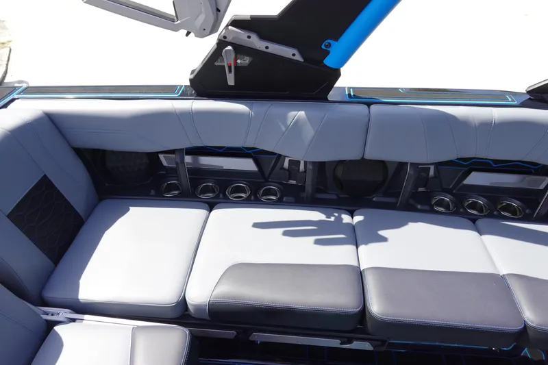 Slide: The Image of 2024 Malibu Wakesetter 23 MXZ interior seating with sleek design and cup holders. - 23
