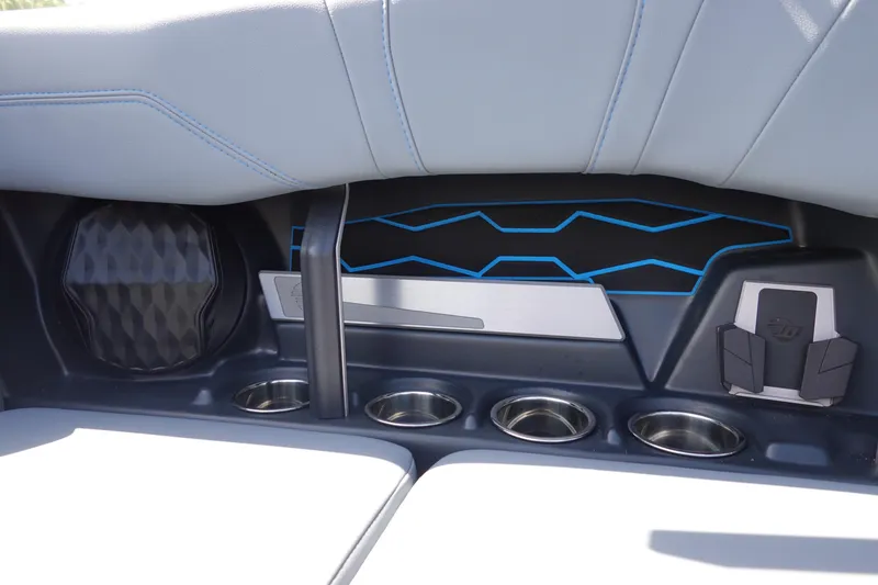 Slide: The Image of 2024 Malibu Wakesetter 23 MXZ interior with cup holders and speaker detail. - 29