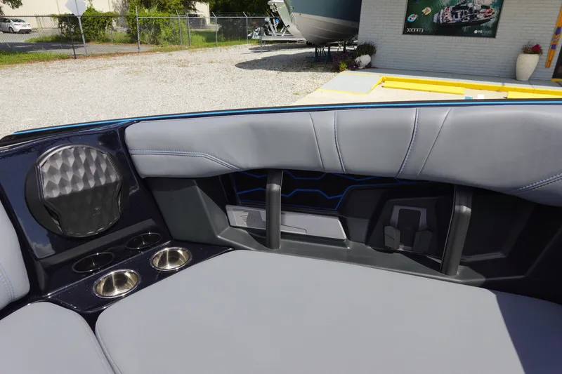 Slide: The Image of 2024 Malibu Wakesetter 23 MXZ interior with gray seating and cup holders. - 34