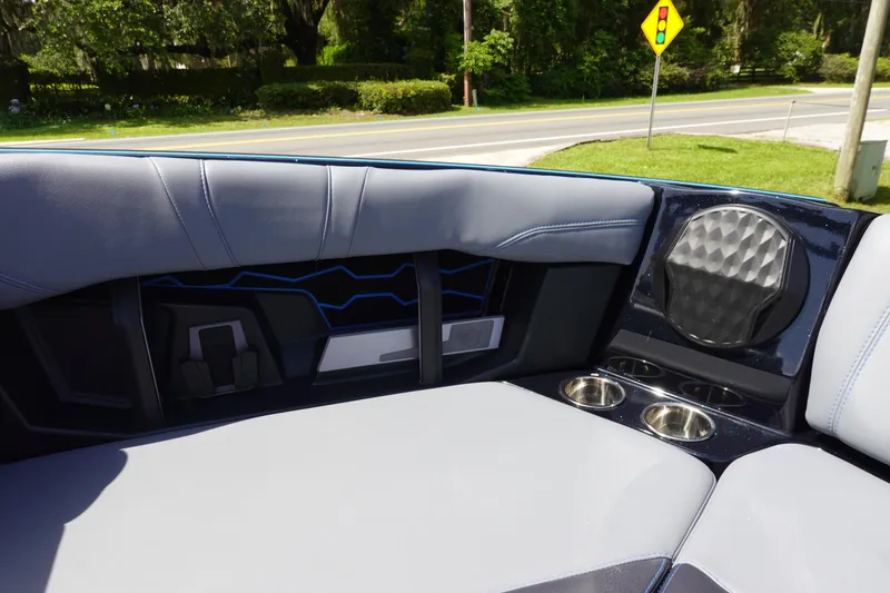 Slide: The Image of 2024 Malibu Wakesetter 23 MXZ interior with sleek seating and cup holders. - 35