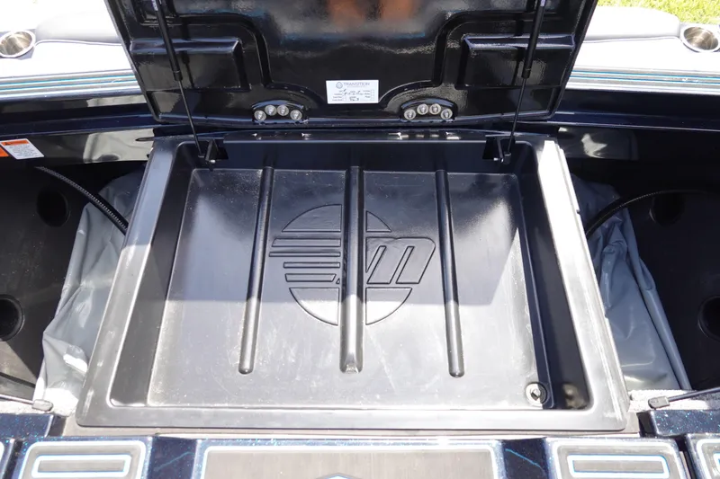 Slide: The Image of Open storage compartment of 2024 Malibu Wakesetter 23 MXZ boat. - 41