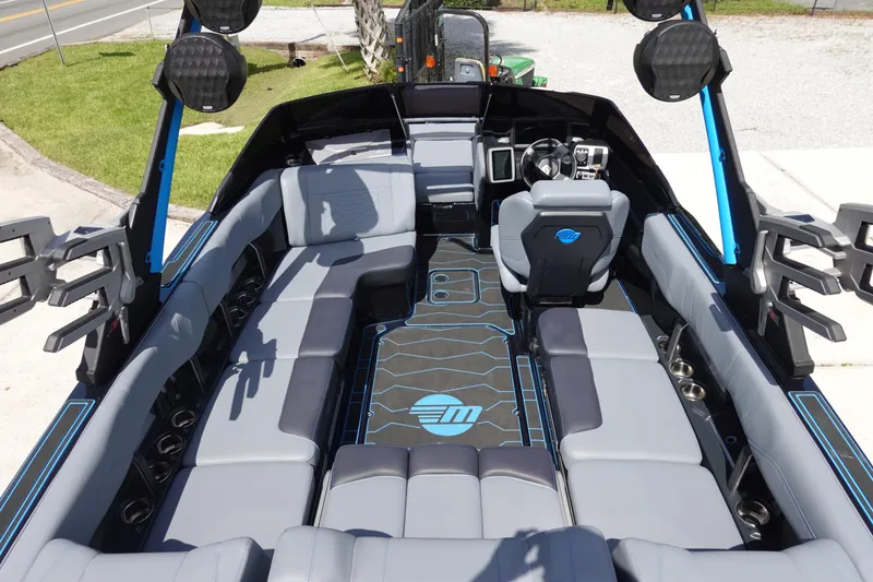 Slide: The Image of 2024 Malibu Wakesetter 23 MXZ interior with spacious seating and modern design. - 9