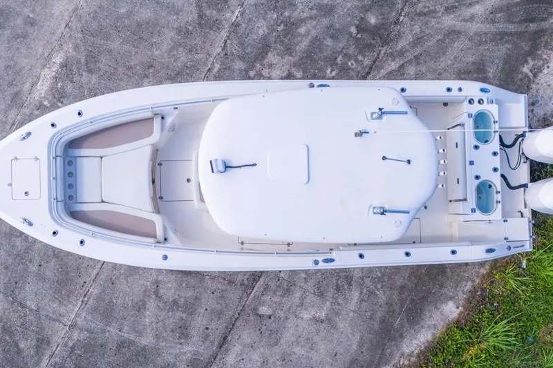 Slide: The Image of Overhead view of 2017 Cobia 296 Center Console boat on concrete surface. - 12