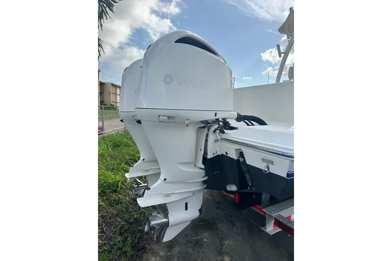 Slide: The Image of 2017 Cobia 296 Center Console with dual Yamaha outboard motors. - 21