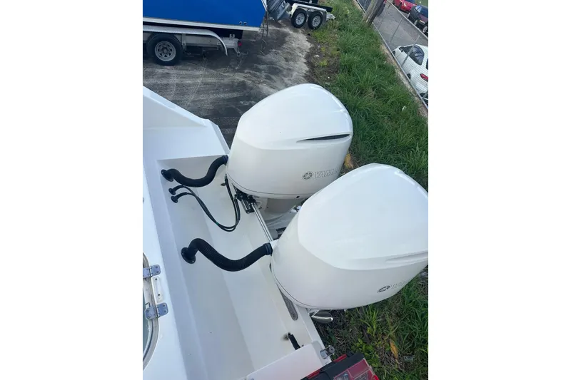 Slide: The Image of 2017 Cobia 296 Center Console with dual Yamaha outboard engines. - 22