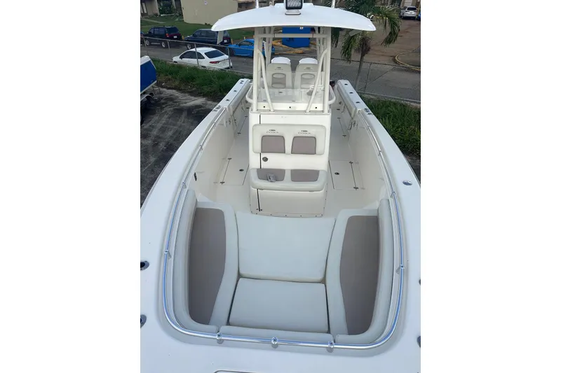 Slide: The Image of 2017 Cobia 296 Center Console boat with spacious seating and sleek design. - 29