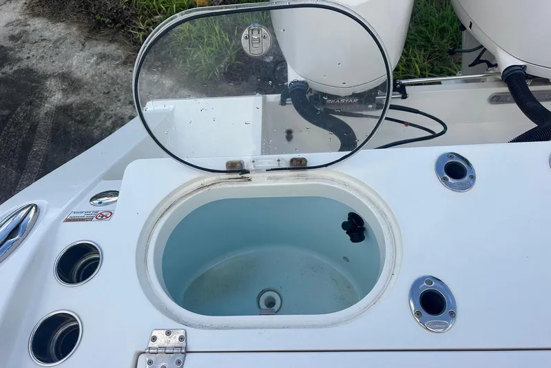 Slide: The Image of Livewell on 2017 Cobia 296 Center Console boat, open lid, clean interior. - 33