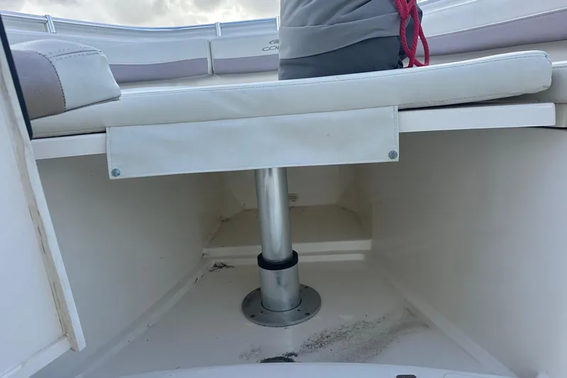 Slide: The Image of 2017 Cobia 296 Center Console boat seating area with storage space underneath. - 38