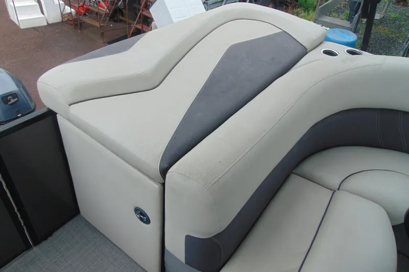 Slide: The Image of 2020 Sylvan Mirage 8520 Cruise boat interior with plush seating and cup holders. - 13