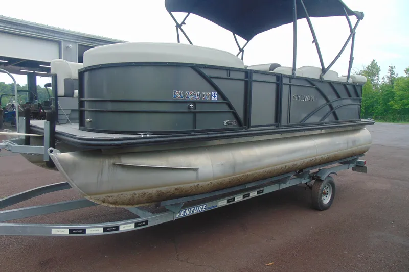 Slide: The Image of 2020 Sylvan Mirage 8520 Cruise pontoon boat on trailer, parked outdoors. - 4