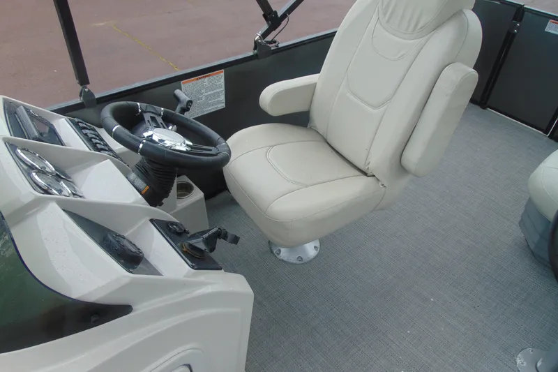Slide: The Image of Captain's chair and helm of 2020 Sylvan Mirage 8520 Cruise pontoon boat. - 8