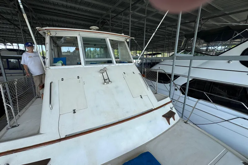 Slide: The Image of 1984 Kadey-Krogen 36 Manatee docked in a covered marina. - 11