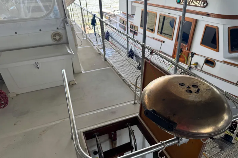 Slide: The Image of Deck view of 1984 Kadey-Krogen 36 Manatee with grill and safety railing. - 19