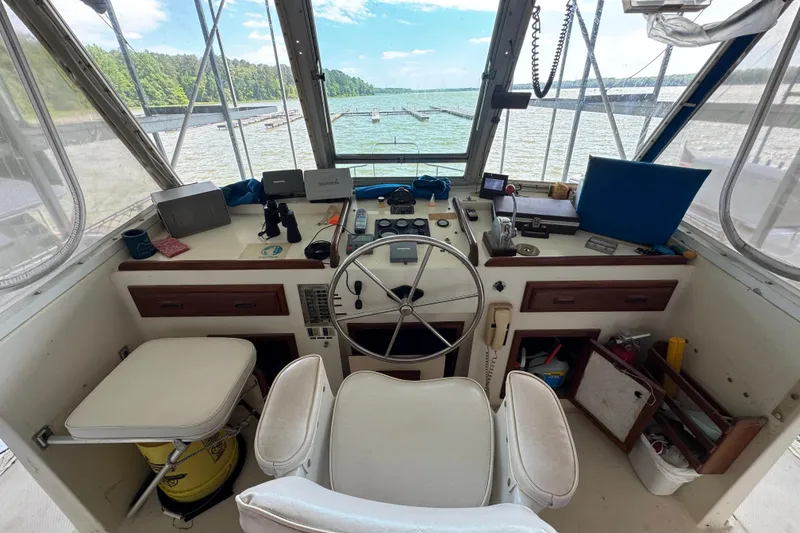 Slide: The Image of Helm of 1984 Kadey-Krogen 36 Manatee with steering wheel and navigation equipment. - 20