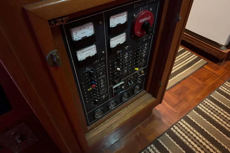 Slide: The Image of Electrical panel inside 1984 Kadey-Krogen 36 Manatee boat, featuring gauges and switches. - 38