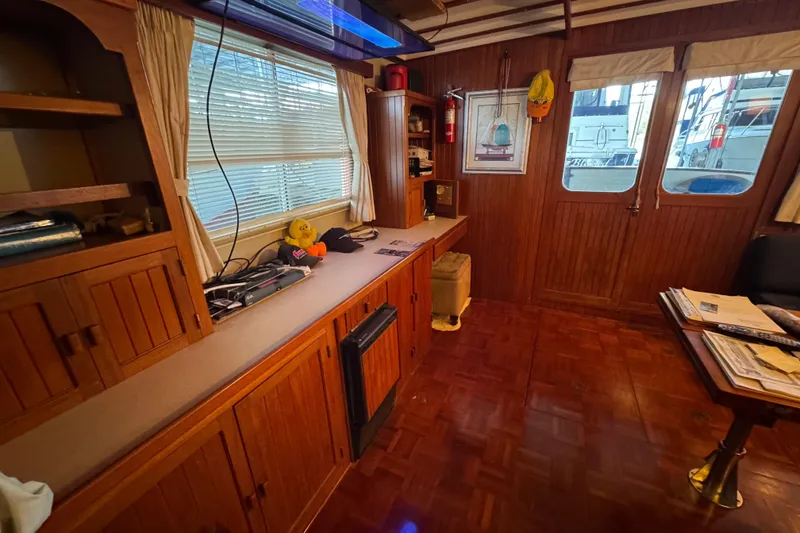 Slide: The Image of Interior of 1984 Kadey-Krogen 36 Manatee with wood paneling and nautical decor. - 45