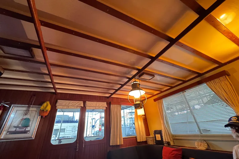 Slide: The Image of Interior of 1984 Kadey-Krogen 36 Manatee with wooden ceiling and nautical decor. - 49