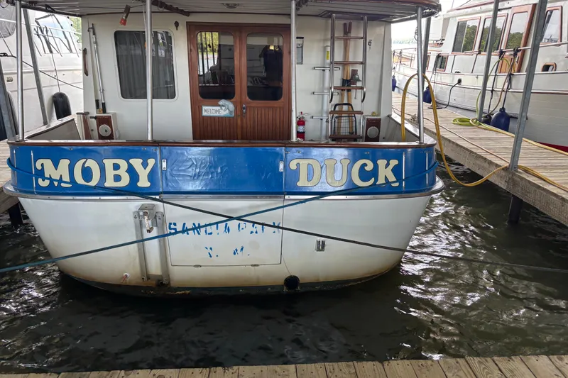 Slide: The Image of Kadey-Krogen 36 Manatee 1984 boat named "Moby Duck" docked at marina. - 7