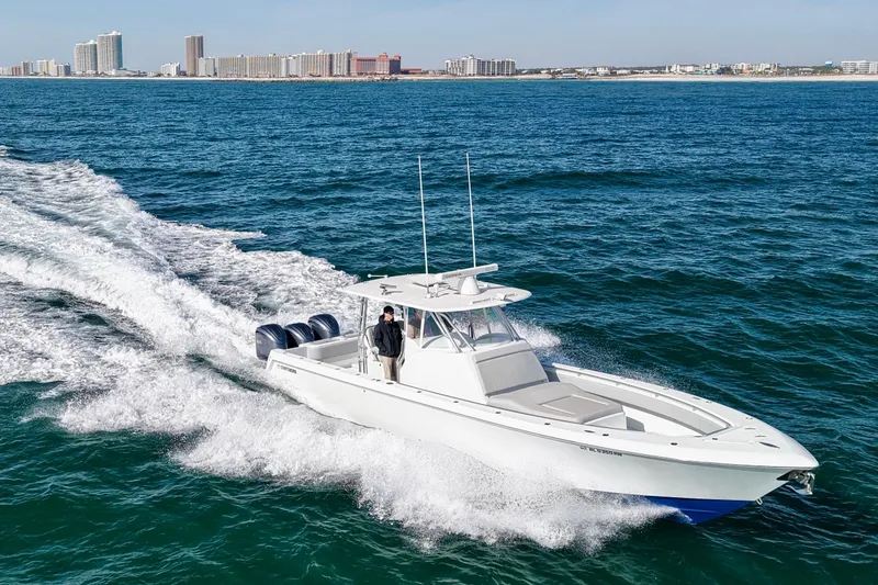 Slide: The Image of 2022 Contender 39 Fisharound cruising on ocean near city skyline. - 10