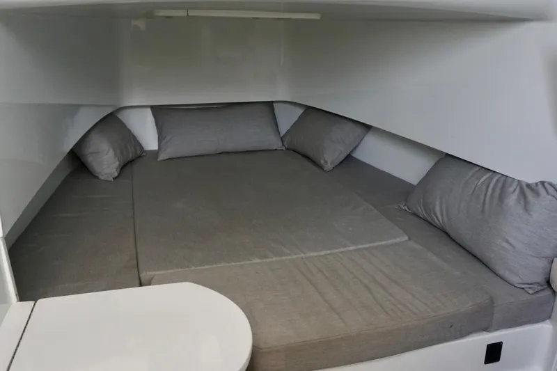 Slide: The Image of Interior cabin of 2022 Contender 39 Fisharound with gray bedding and pillows. - 17