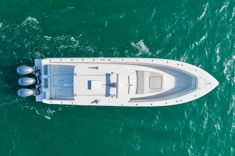 Slide: The Image of Aerial view of 2022 Contender 39 Fisharound boat on turquoise water. - 4