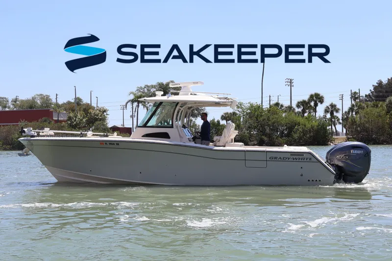 The Image of 2021 Grady-White Canyon 336 boat on water with Seakeeper logo in background. - 0