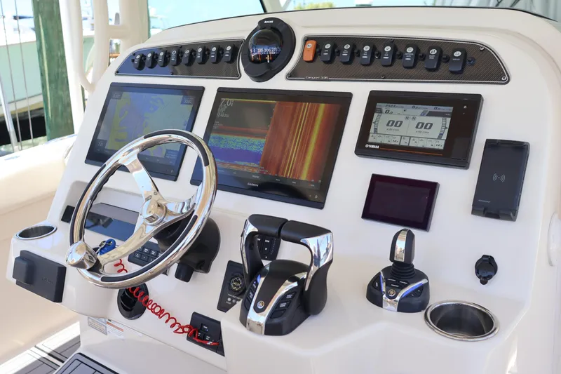 Slide: The Image of Control panel of 2021 Grady-White Canyon 336 boat with advanced navigation displays. - 22