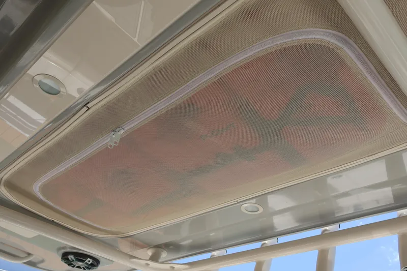 Slide: The Image of Grady-White Canyon 336 boat roof detail, featuring a mesh storage compartment, 2021 model. - 38