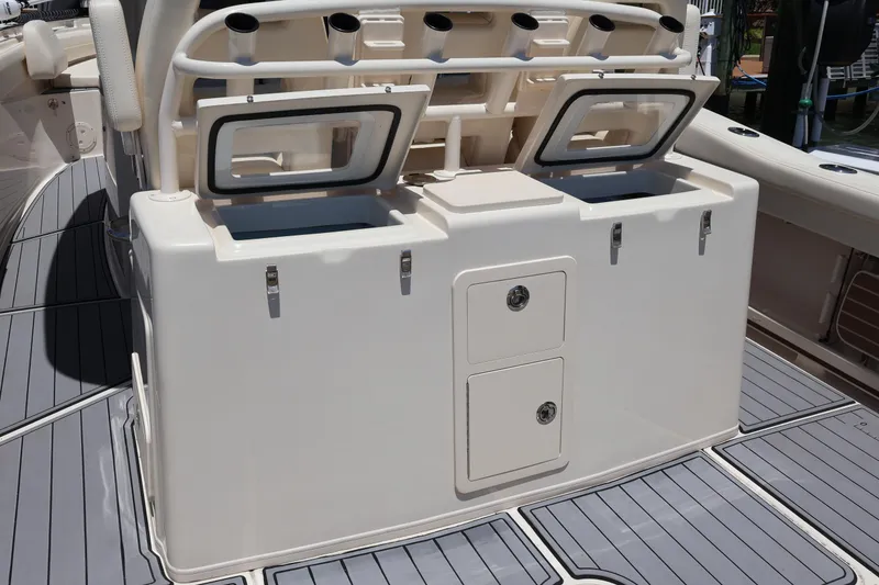 Slide: The Image of 2021 Grady-White Canyon 336 boat with open storage compartments on deck. - 42