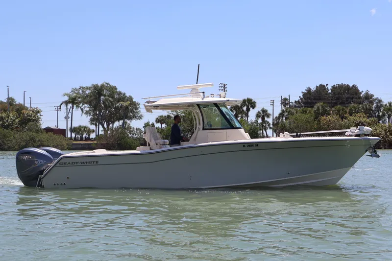 Slide: The Image of 2021 Grady-White Canyon 336 boat cruising on a sunny day. - 5