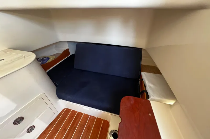 Slide: The Image of 2021 Grady-White Canyon 336 cabin interior with seating and wooden flooring. - 59