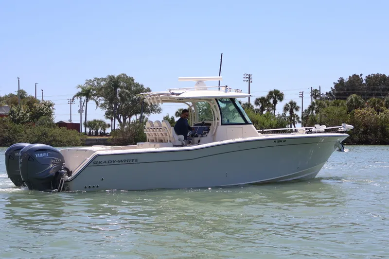 Slide: The Image of 2021 Grady-White Canyon 336 boat cruising on a sunny day with Yamaha engines. - 6